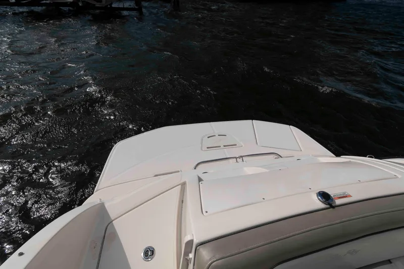 Slide: The Image of 2007 Sea Ray 260 Sundeck boat on water, rear view, sunny day. - 10