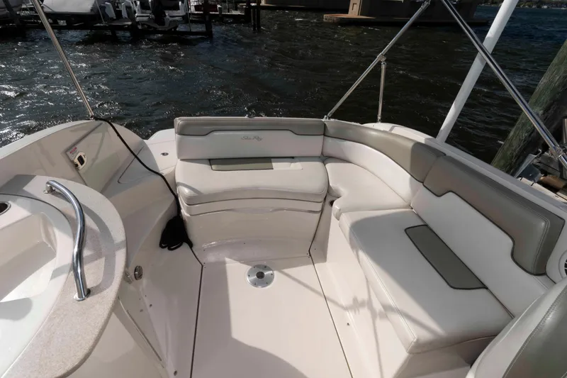 Slide: The Image of 2007 Sea Ray 260 Sundeck interior with cushioned seating and water view. - 4
