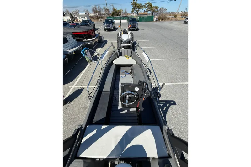 Slide: The Image of 2021 Whaly 445R boat in parking lot, showcasing interior and steering console. - 10