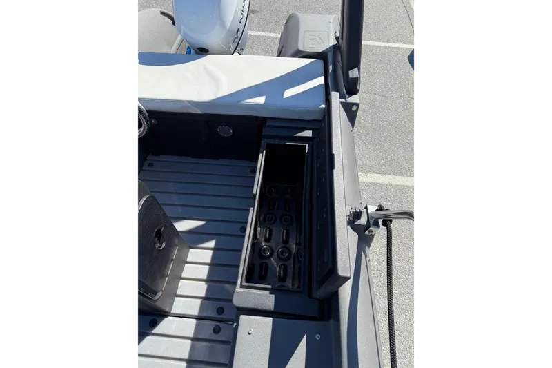 Slide: The Image of 2021 Whaly 445R boat interior with storage compartment and seating area. - 13