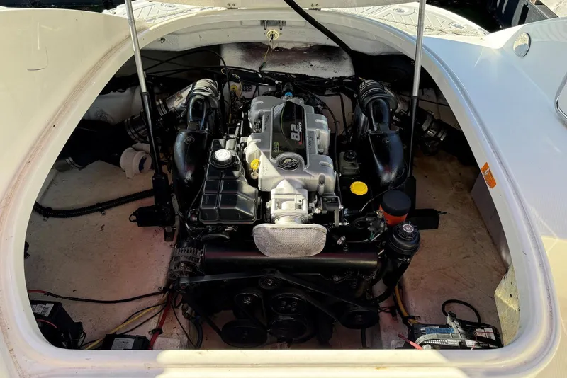 Slide: The Image of Engine compartment of a 2012 Chaparral 2870 SSX boat, showcasing the powerful motor. - 8