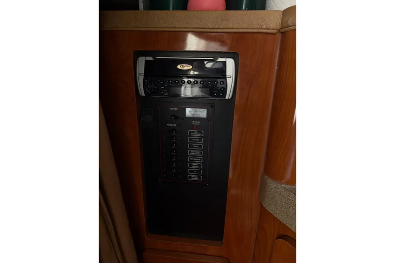 Slide: The Image of Control panel and stereo system in 2003 Wellcraft 2600 Martinique boat interior. - 7