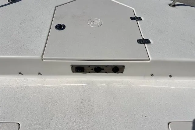 Slide: The Image of 2022 Carolina Skiff 21 LS boat deck with storage compartment and hatch. - 10