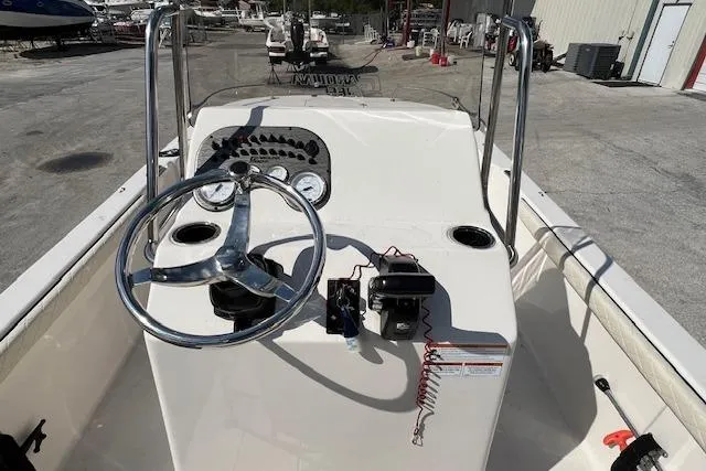 Slide: The Image of 2022 Carolina Skiff 21 LS boat dashboard with steering wheel and controls. - 4