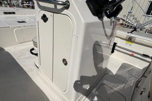 Slide: The Image of 2022 Carolina Skiff 21 LS boat interior, featuring console and seating area. - 5