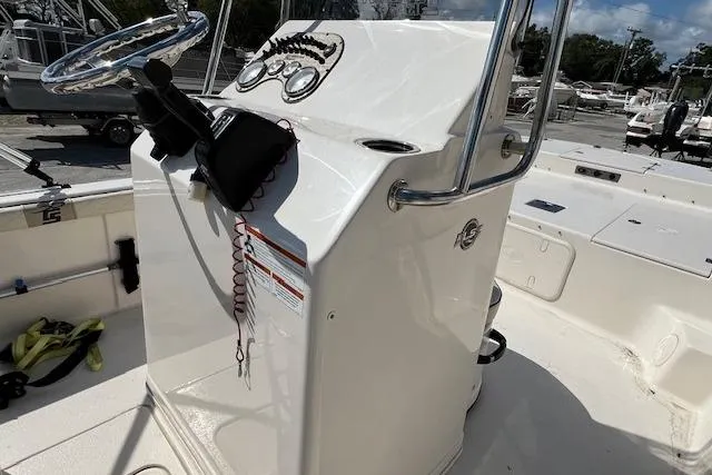 Slide: The Image of Center console of a 2022 Carolina Skiff 21 LS boat, featuring steering wheel and controls. - 6