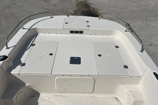 Slide: The Image of 2022 Carolina Skiff 21 LS boat deck with storage compartments and railings. - 8
