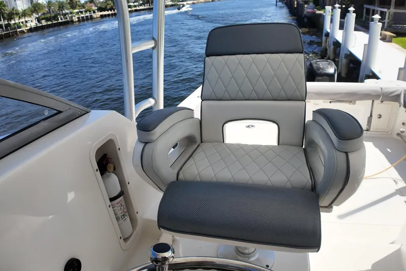Slide: The Image of Luxury seating on 2005 Boston Whaler 305 Conquest boat, dockside view. - 11