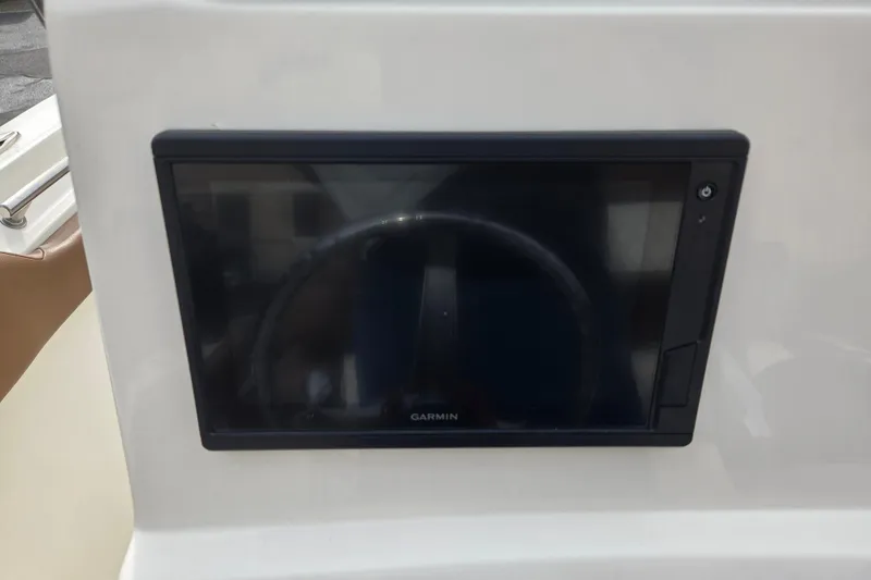 Slide: The Image of Garmin display on 2024 Pioneer 202 Islander boat dashboard. - 12