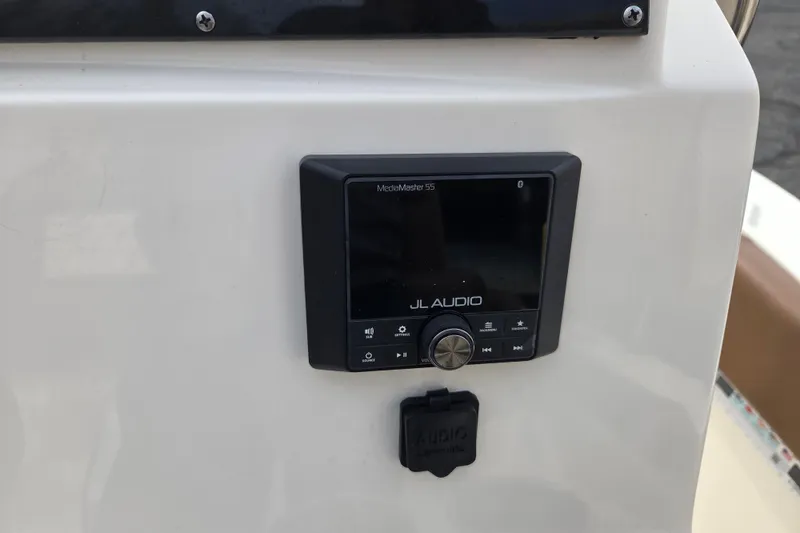 Slide: The Image of JL Audio MediaMaster 55 on 2024 Pioneer 202 Islander boat dashboard. - 13