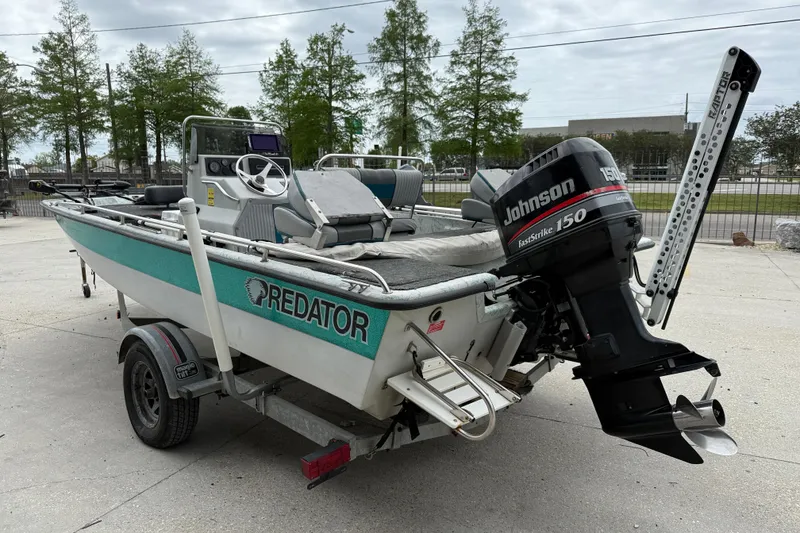 Slide: The Image of 1998 Predator 18ft CC boat with Johnson 150 engine on trailer. - 4