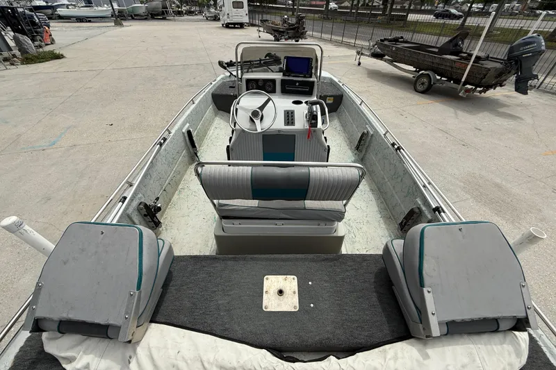 Slide: The Image of 1998 Predator 18ft CC boat interior with steering console and seating. - 7