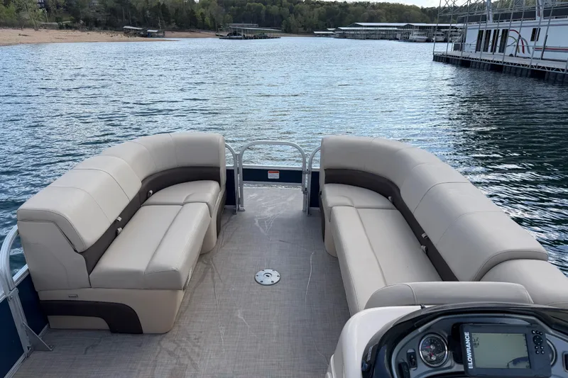 Slide: The Image of 2019 Sun Tracker Party Barge 22 Sport Fish pontoon boat with spacious seating on a serene lake. - 11