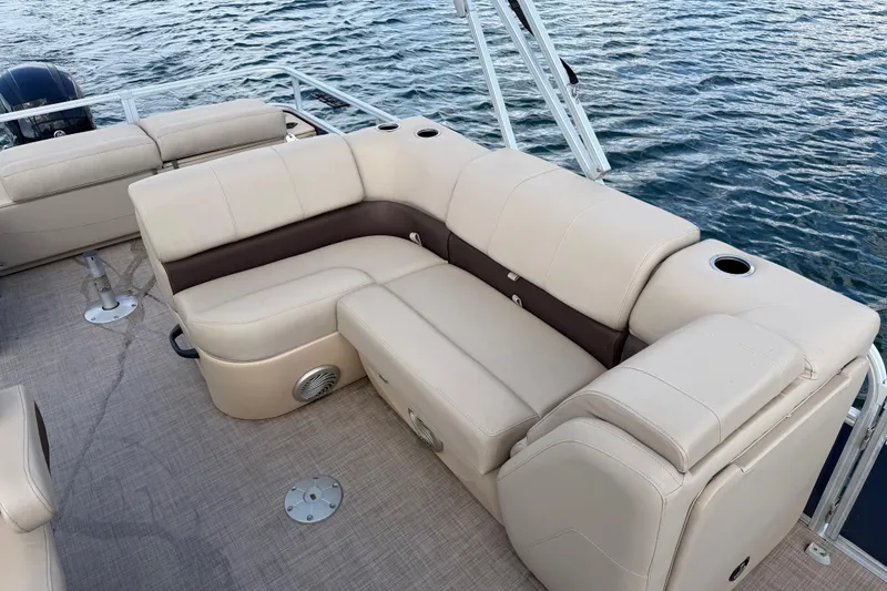 Slide: The Image of 2019 Sun Tracker Party Barge 22 Sport Fish with beige seating on water. - 14