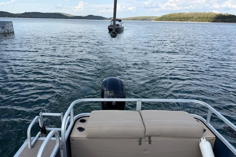 Slide: The Image of 2019 Sun Tracker Party Barge 22 Sport Fish on a scenic lake with distant hills. - 17