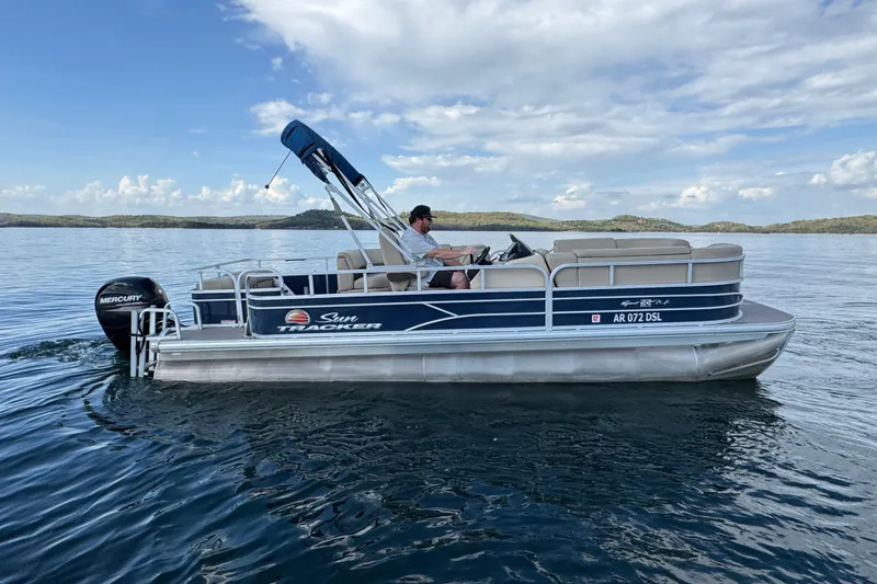 Slide: The Image of 2019 Sun Tracker Party Barge 22 Sport Fish pontoon boat on a serene lake. - 3