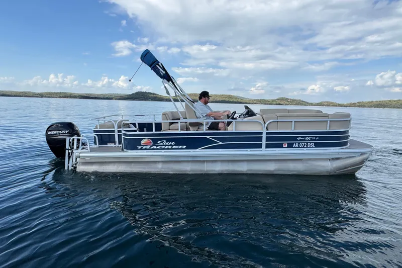 Slide: The Image of 2019 Sun Tracker Party Barge 22 Sport Fish pontoon boat on a serene lake. - 4