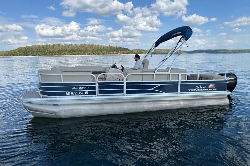 Slide: The Image of 2019 Sun Tracker Party Barge 22 Sport Fish pontoon boat on a serene lake. - 6