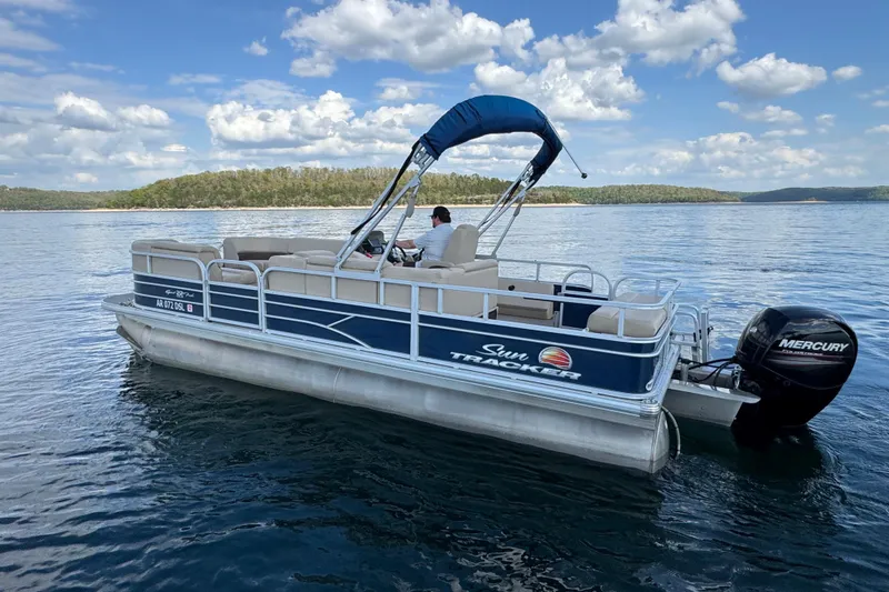 Slide: The Image of 2019 Sun Tracker Party Barge 22 Sport Fish pontoon boat on a serene lake. - 7