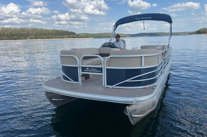 Slide: The Image of 2019 Sun Tracker Party Barge 22 Sport Fish pontoon boat on a serene lake. - 8