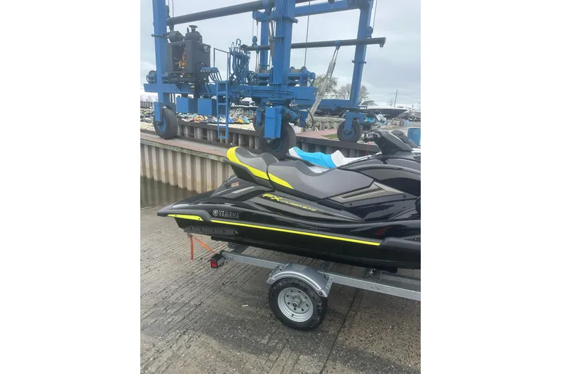 Slide: The Image of 2023 Yamaha WaveRunner FX Cruiser SVHO on trailer near dockside crane. - 5