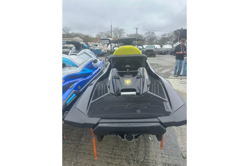 Slide: The Image of 2023 Yamaha WaveRunner FX Cruiser SVHO in a parking lot, rear view. - 7