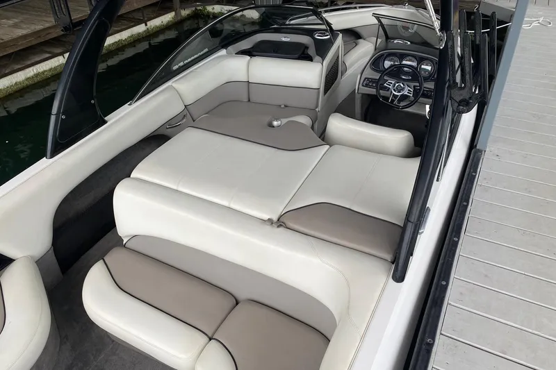 Slide: The Image of 2004 Malibu Wakesetter 21 XTi boat interior with white and beige seating. - 5