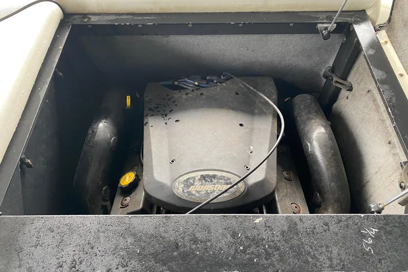 Slide: The Image of 2004 Malibu Wakesetter 21 XTi engine compartment with visible components and wiring. - 9