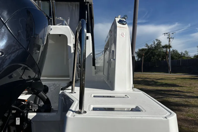 Slide: The Image of 2024 Jeanneau NC Sport 895 boat deck with railing and engine detail. - 22