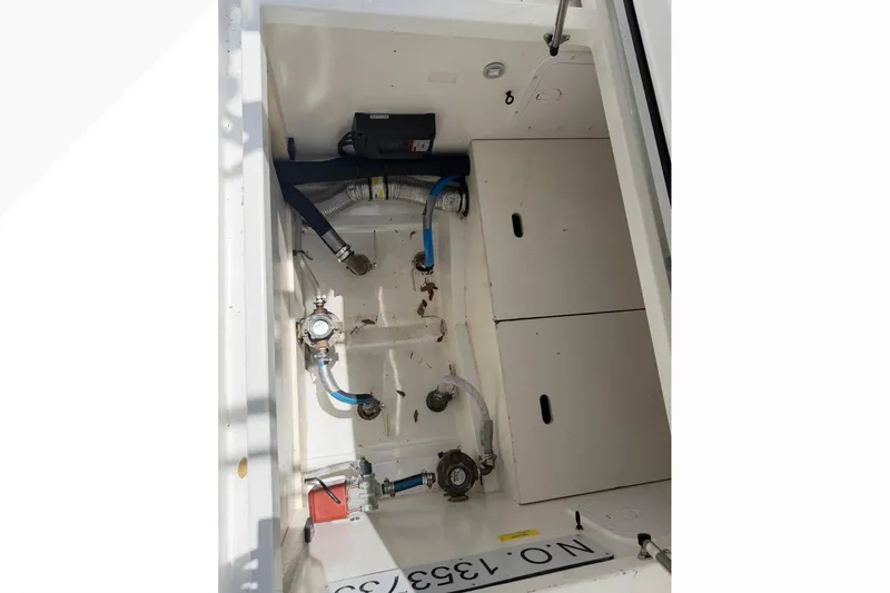 Slide: The Image of 2024 Jeanneau NC Sport 895 boat interior showing storage and mechanical components. - 31