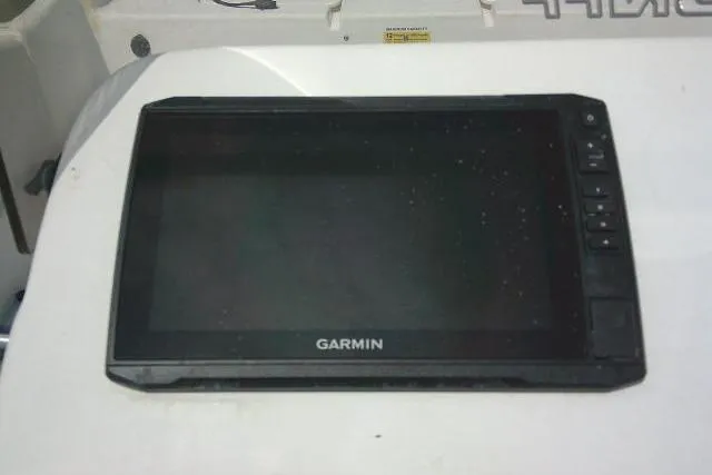 Slide: The Image of Garmin device on 2015 Carolina Skiff 2180 DLX boat dashboard. - 17