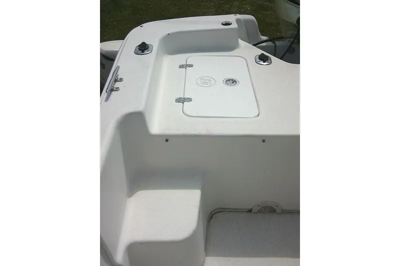 Slide: The Image of 2015 Carolina Skiff 2180 DLX boat deck with storage compartment and seating area. - 20