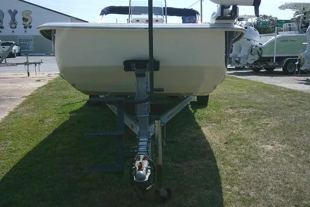 Slide: The Image of 2015 Carolina Skiff 2180 DLX on trailer, parked on grass, rear view. - 4