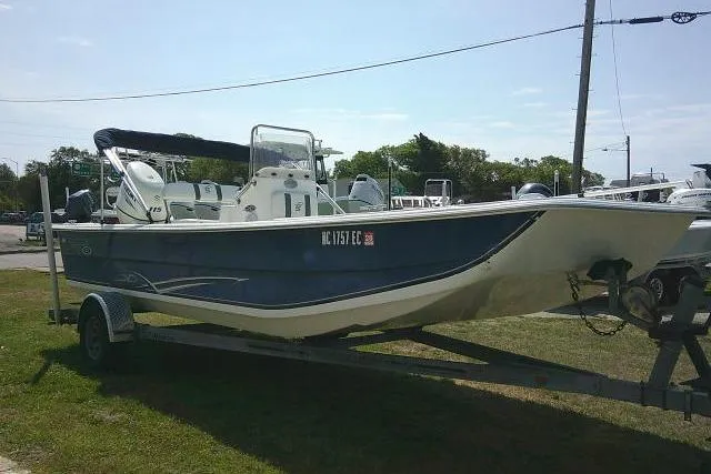 Slide: The Image of 2015 Carolina Skiff 2180 DLX boat on trailer, parked outdoors. - 5