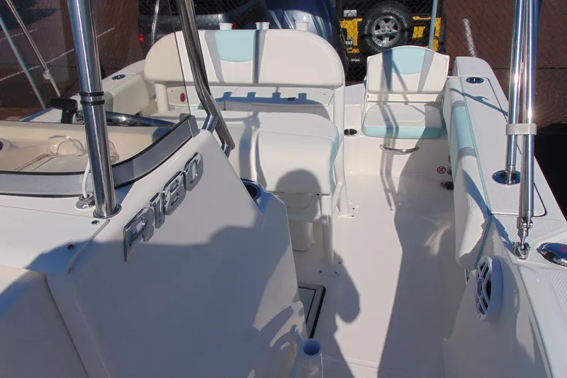 Slide: The Image of 2025 Robalo R180 Center Console boat interior with seating and steering area. - 15
