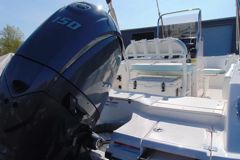 Slide: The Image of 2025 Robalo R180 Center Console boat with Yamaha 150 engine, featuring spacious seating. - 4