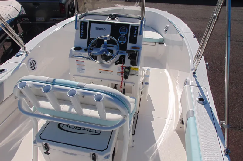 Slide: The Image of 2025 Robalo R180 Center Console boat interior with steering wheel and seating. - 5