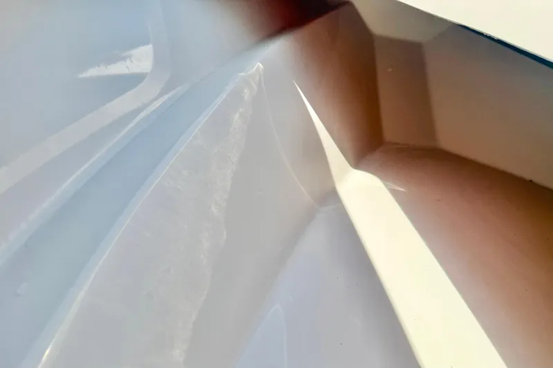 Slide: The Image of Interior view of 2026 Carolina Skiff 22 Ultra Elite boat hull, showcasing sleek design. - 18