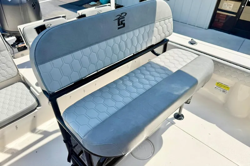 Slide: The Image of 2026 Carolina Skiff 22 Ultra Elite boat seating with hexagonal pattern upholstery. - 22