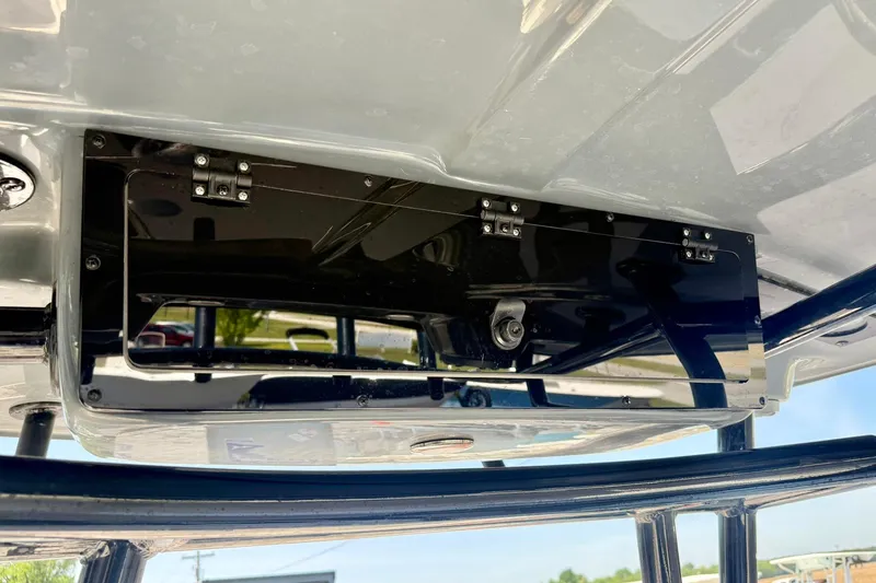 Slide: The Image of 2026 Carolina Skiff 22 Ultra Elite boat detail, featuring a sleek black storage compartment. - 26