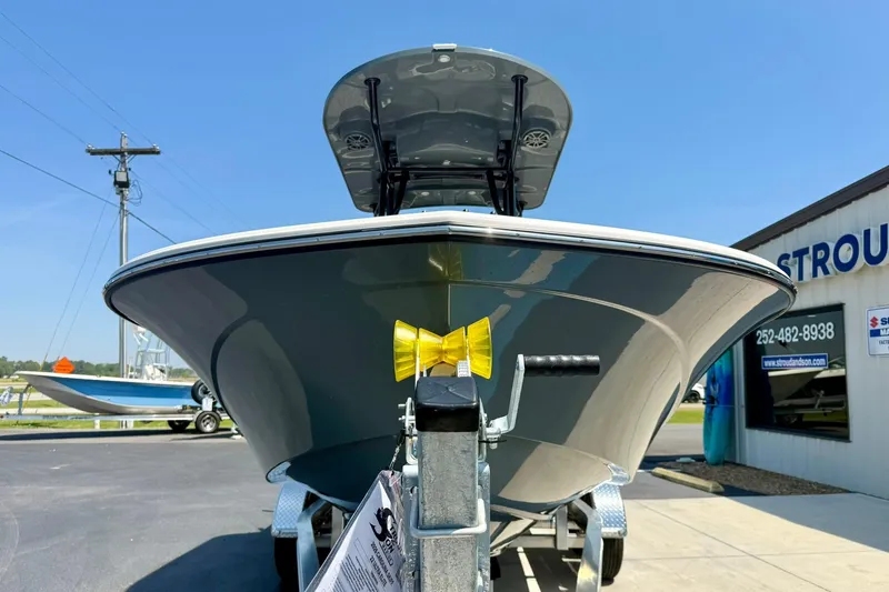 Slide: The Image of 2026 Carolina Skiff 22 Ultra Elite boat on trailer, displayed outdoors. - 8