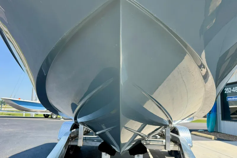 Slide: The Image of 2026 Carolina Skiff 22 Ultra Elite boat hull on trailer, close-up view. - 9