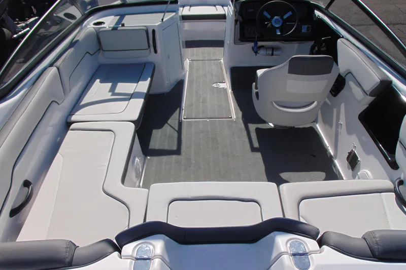 Slide: The Image of 2024 Yamaha Boats AR190 interior with spacious seating and modern helm design. - 6