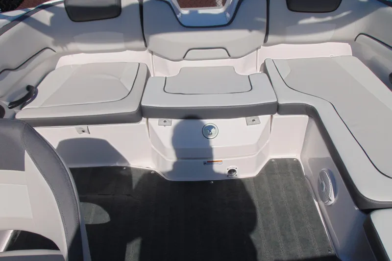 Slide: The Image of 2024 Yamaha Boats AR190 interior seating with gray upholstery and spacious layout. - 7