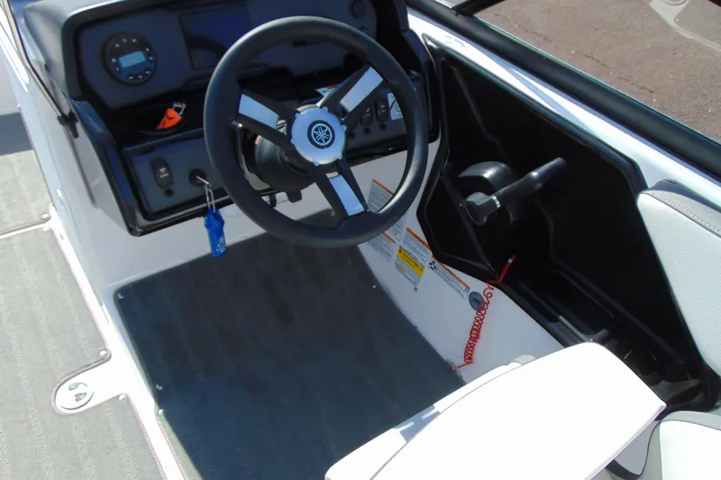 Slide: The Image of 2024 Yamaha Boats AR190 steering console with modern controls and sleek design. - 9