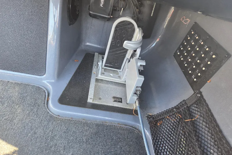 Slide: The Image of Foot pedal and control panel in 2019 Skeeter FX21 Apex boat cockpit. - 10