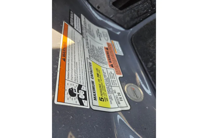 Slide: The Image of Warning labels on 2019 Skeeter FX21 Apex boat, detailing maximum capacities and safety information. - 14