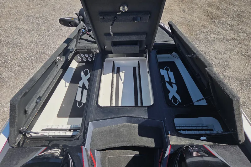 Slide: The Image of 2019 Skeeter FX21 Apex boat interior with open storage compartments. - 15