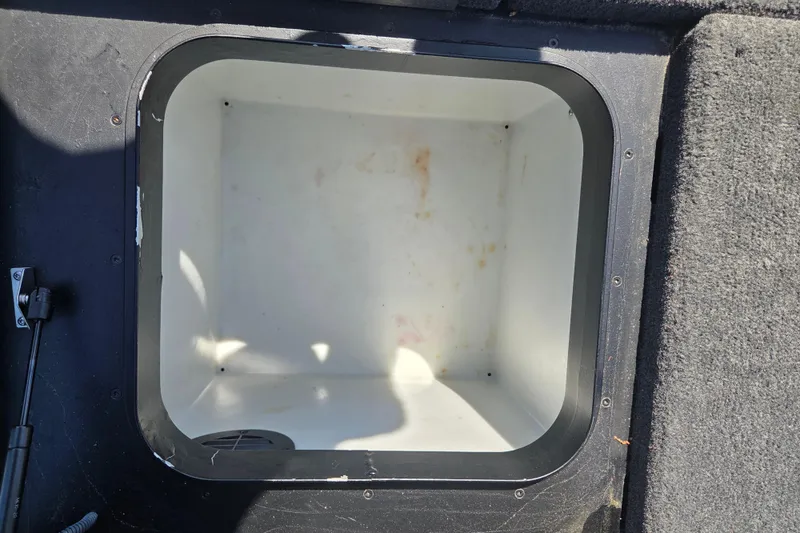 Slide: The Image of 2019 Skeeter FX21 Apex boat storage compartment, open and empty. - 19