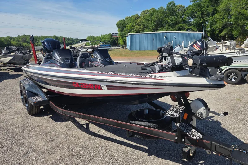 Slide: The Image of 2019 Skeeter FX21 Apex boat on trailer in outdoor setting. - 2